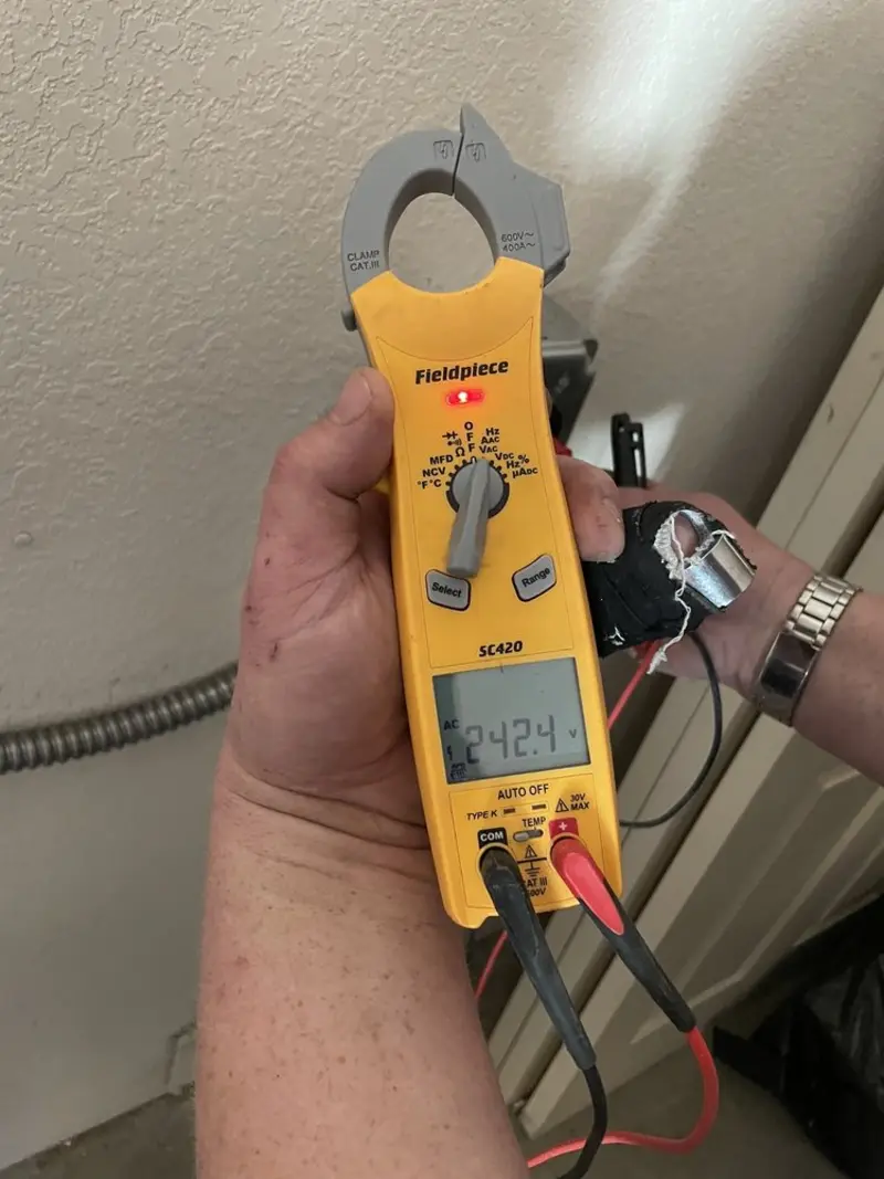 Voltage testing with clamp meter during Recessed Lighting Installation in Bloomington